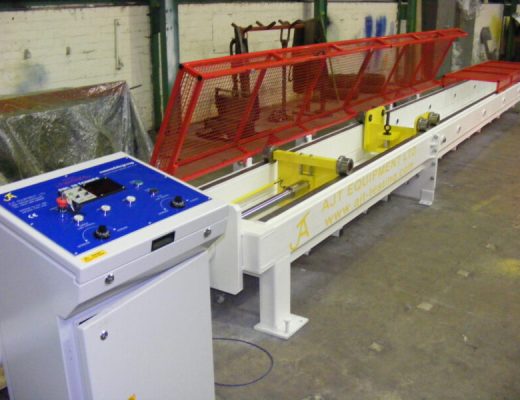 white horizontal tensile tese machine with red guards and blue top to the electrical control panel