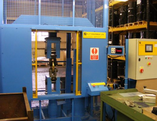 Vertical Tensile Test machine blue, with yellow sliding mesh guards.